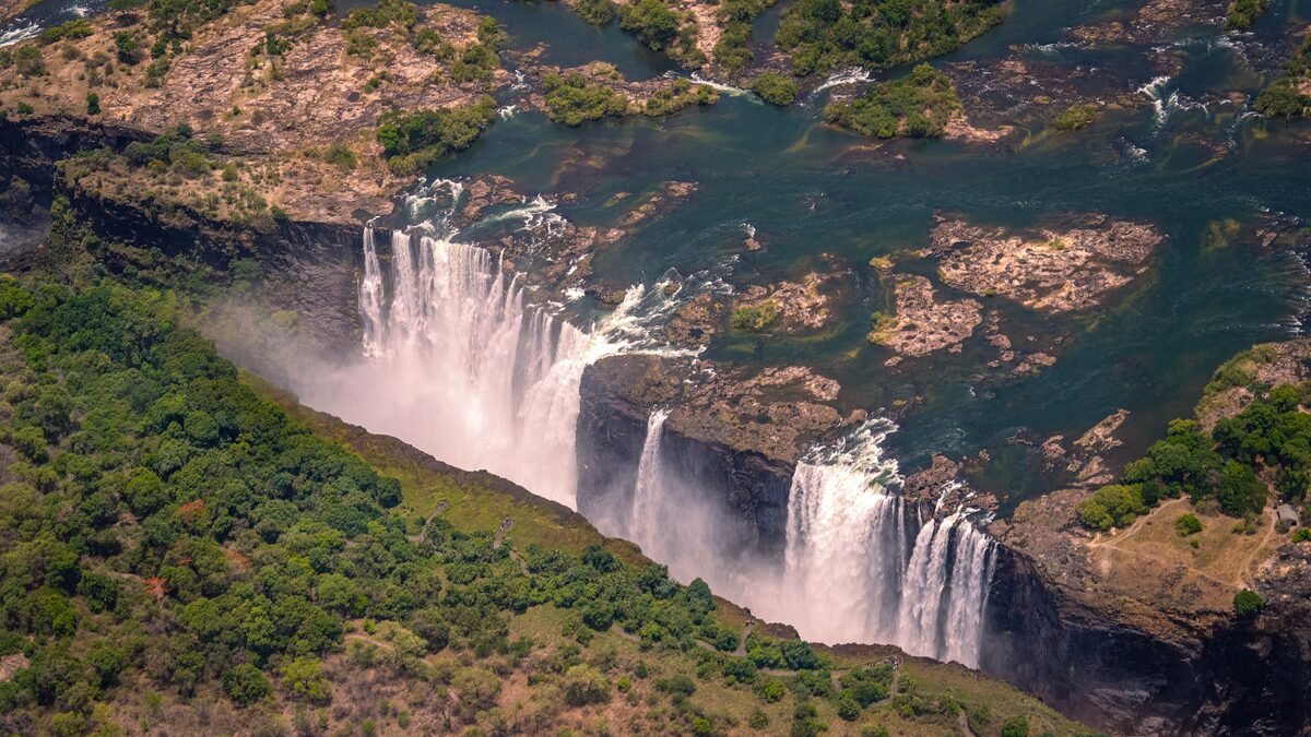 Aerial view of Victoria Falls in Zimbabwe showing the full width of the falls and gorge