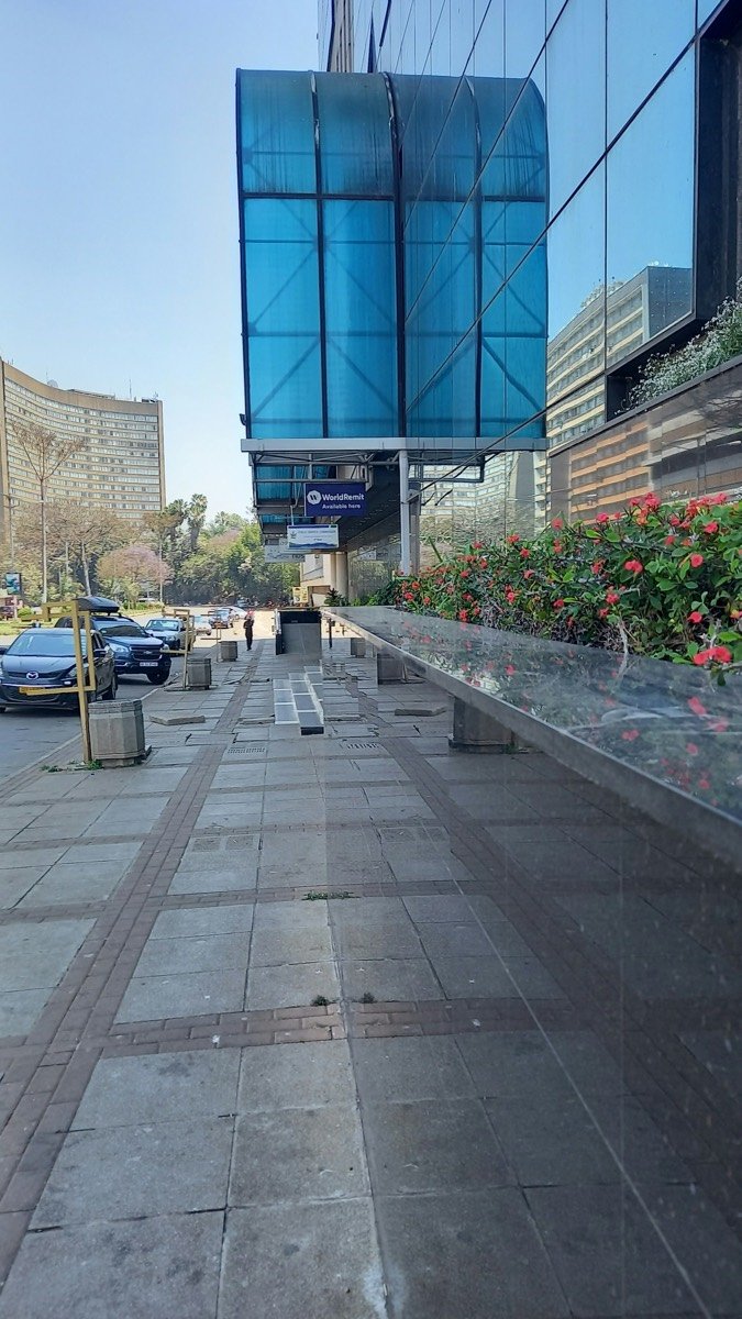 A sidewalk with a building in the background, Harare, Zimbabwe