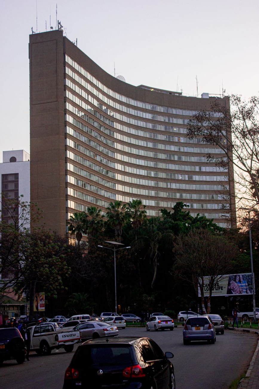 Monomotapa Hotel in central Harare, Zimbabwe, with city traffic on a clear evening