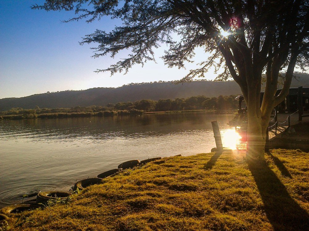 Body of water near trees during sunset, Zimbabwe