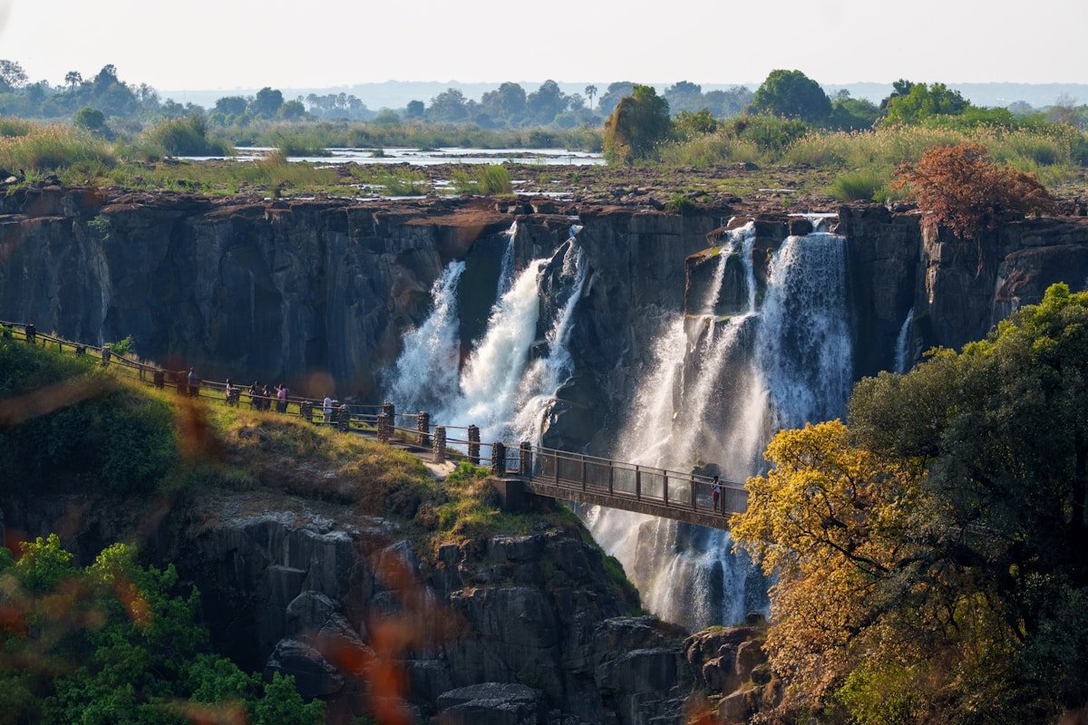 Victoria Falls waterfall with viewing walkway along the gorge rim, Zimbabwe