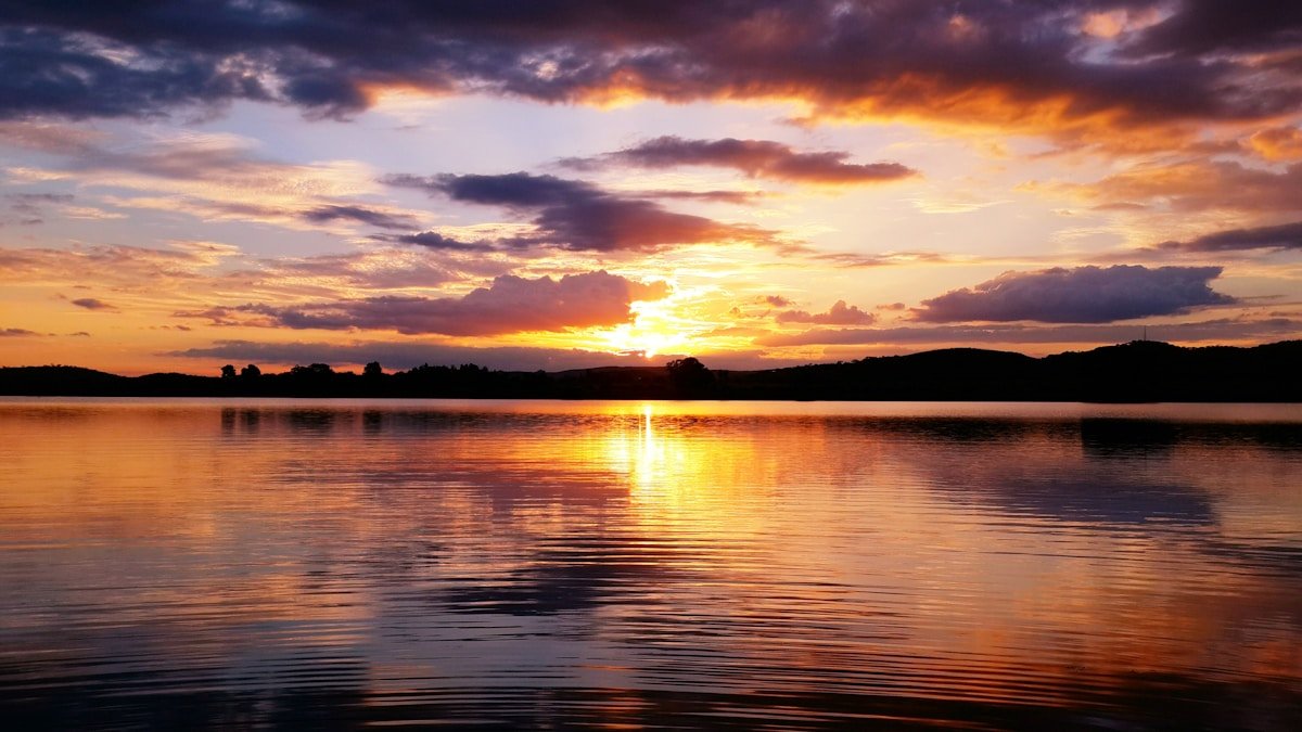Sunset glow over a calm lake in Zimbabwe