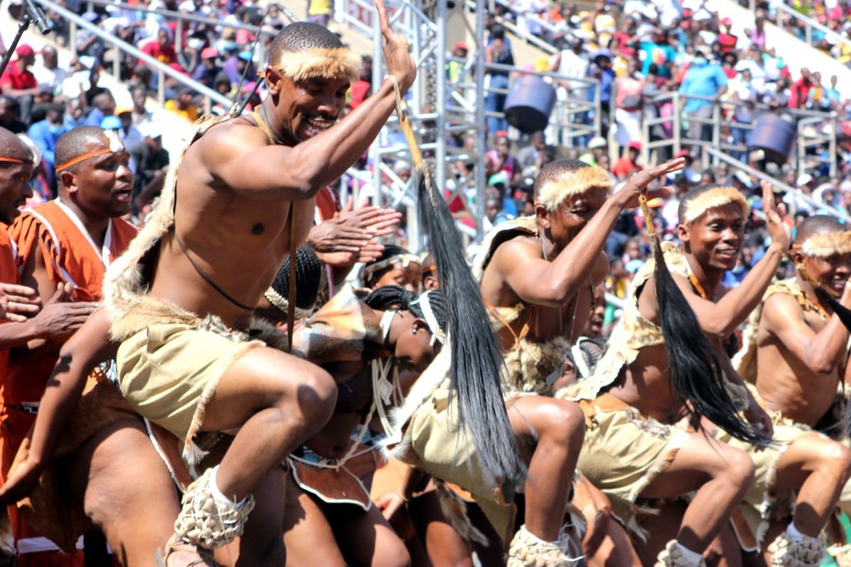 Traditional dancers in traditional attire performing at a community gathering in Harare, Zimbabwe