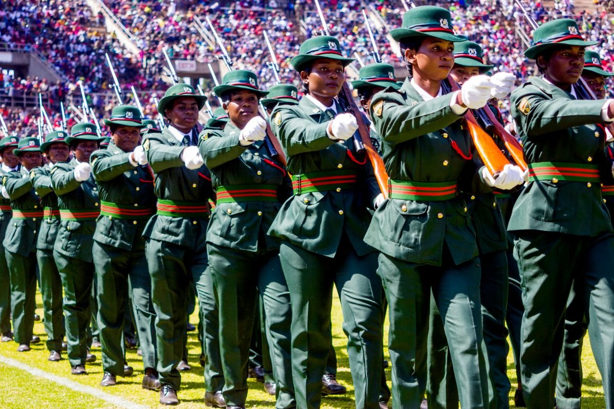 Uniformed women marching in a Heroes Day military parade at a Harare stadium, Zimbabwe